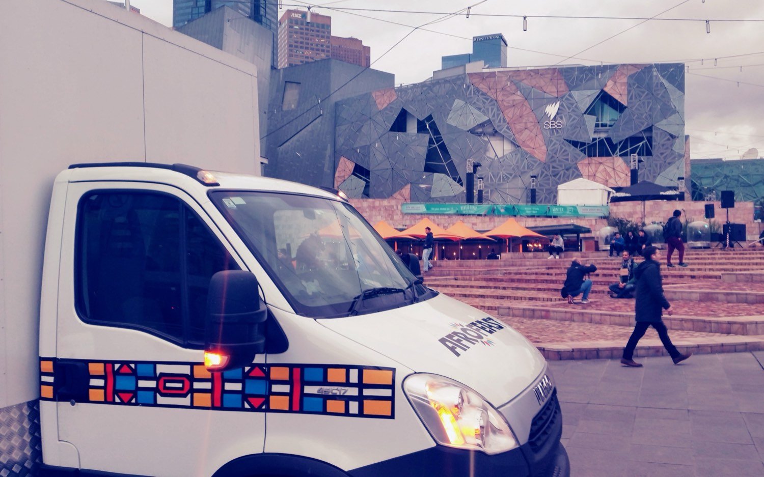 The original Afrofeast Iveco food truck, wrapped in Ndebele patterns, parked at Federation Square in Melbourne