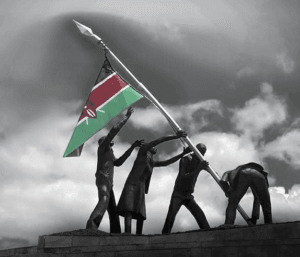 Mashujaa day celebrations (men lifting up the Kenyan flag 